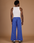 Back view of Isaac wearing the Cornflower Blue Action Pant