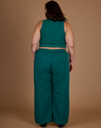 Back view of the Hunter Green Action Pant on Kristen