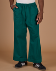 Hunter Green Action Pant with Isaac's hand in the front pocket