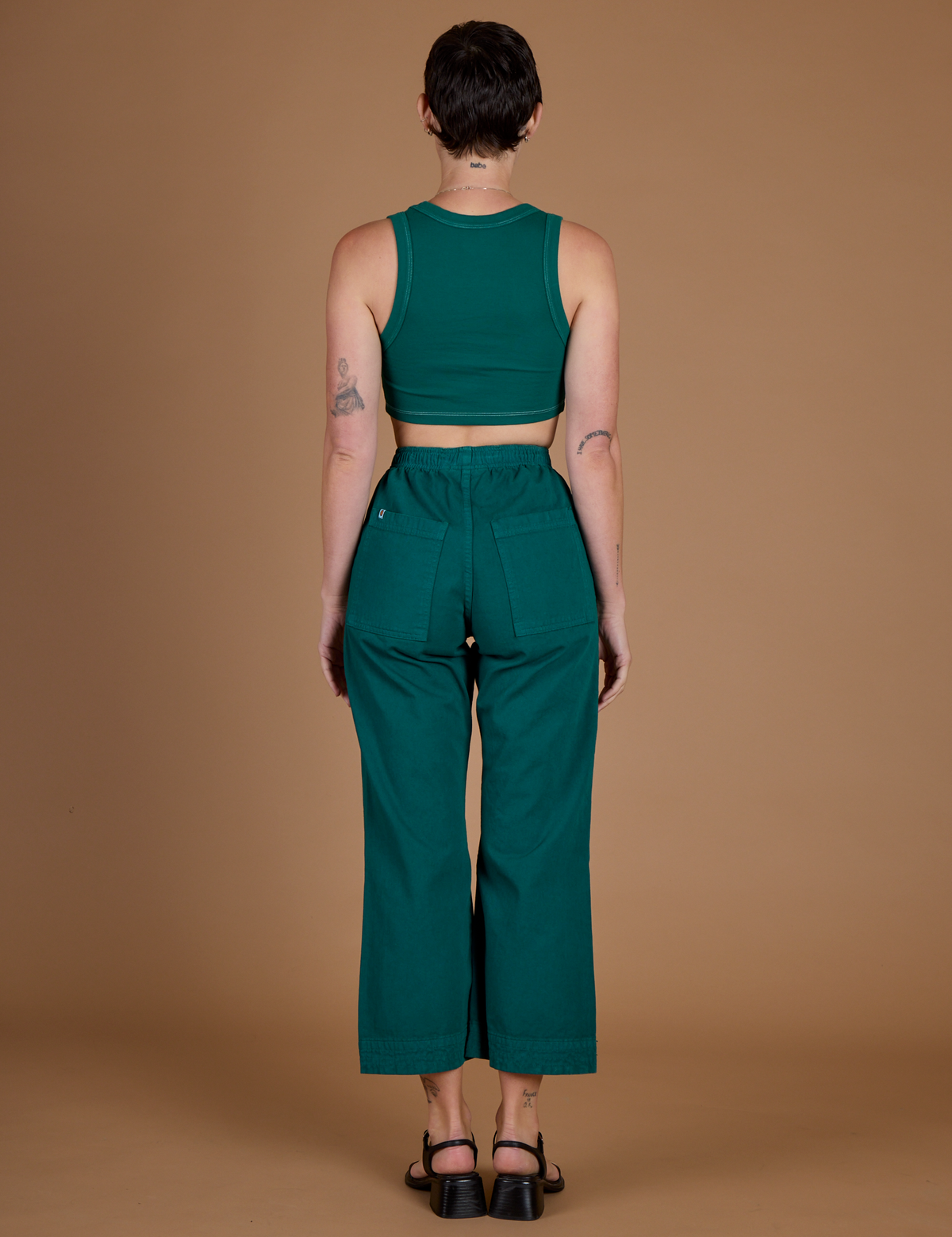 Back view of the Hunter Green Action Pant on Alex