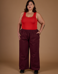 Kristen is 5'9" and wearing 2XL Red Wine Action Pant with Mustang Tank Top
