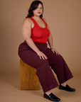 Kristen wearing the Red Wine Action Pant with the Mustang Tank Top
