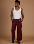 Issac wearing the Red Wine Action Pant with the Vintage Tee Off-White Tank Top