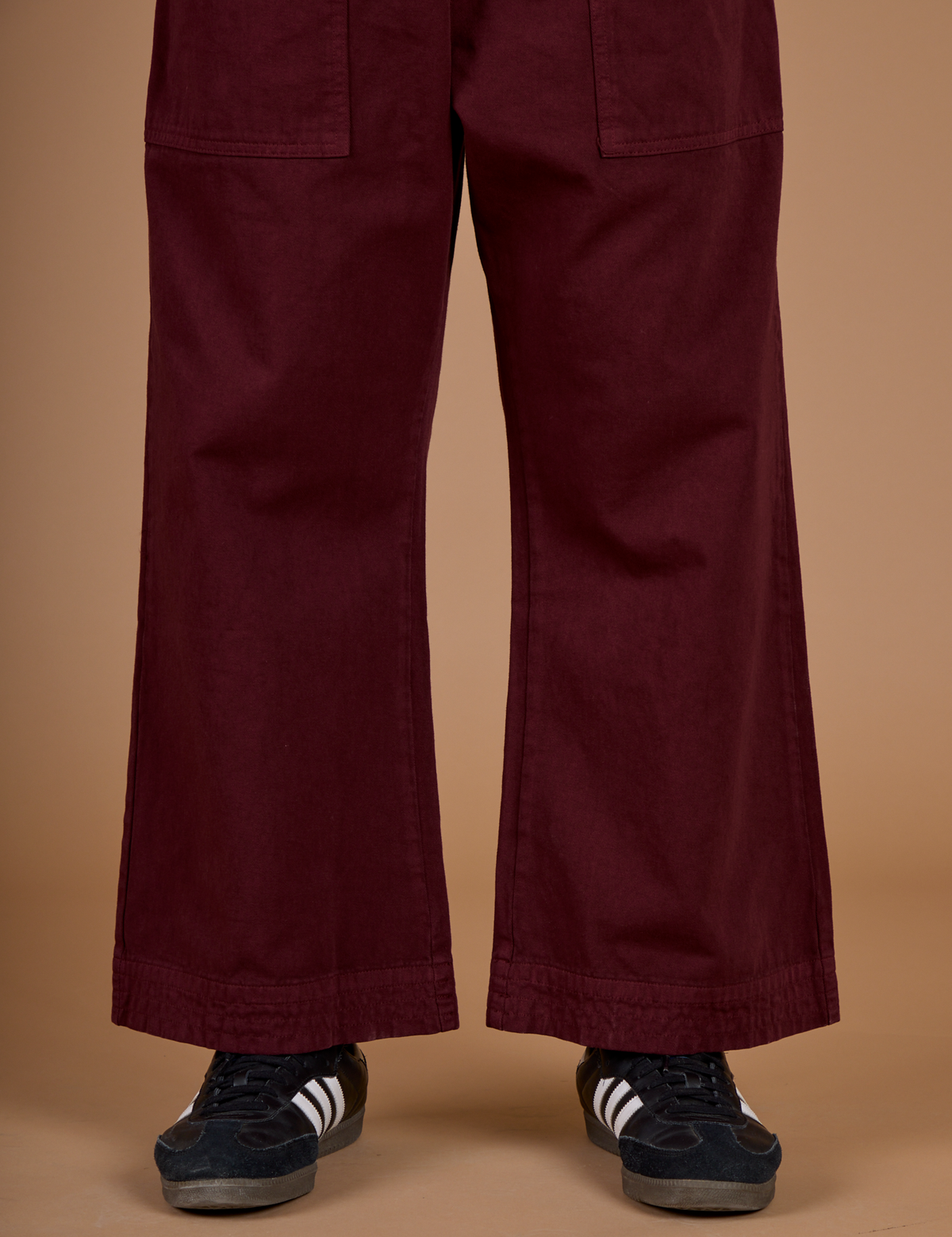 Close up of the Red Wine Action Pant on Isaac