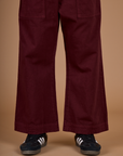 Close up of the Red Wine Action Pant on Isaac