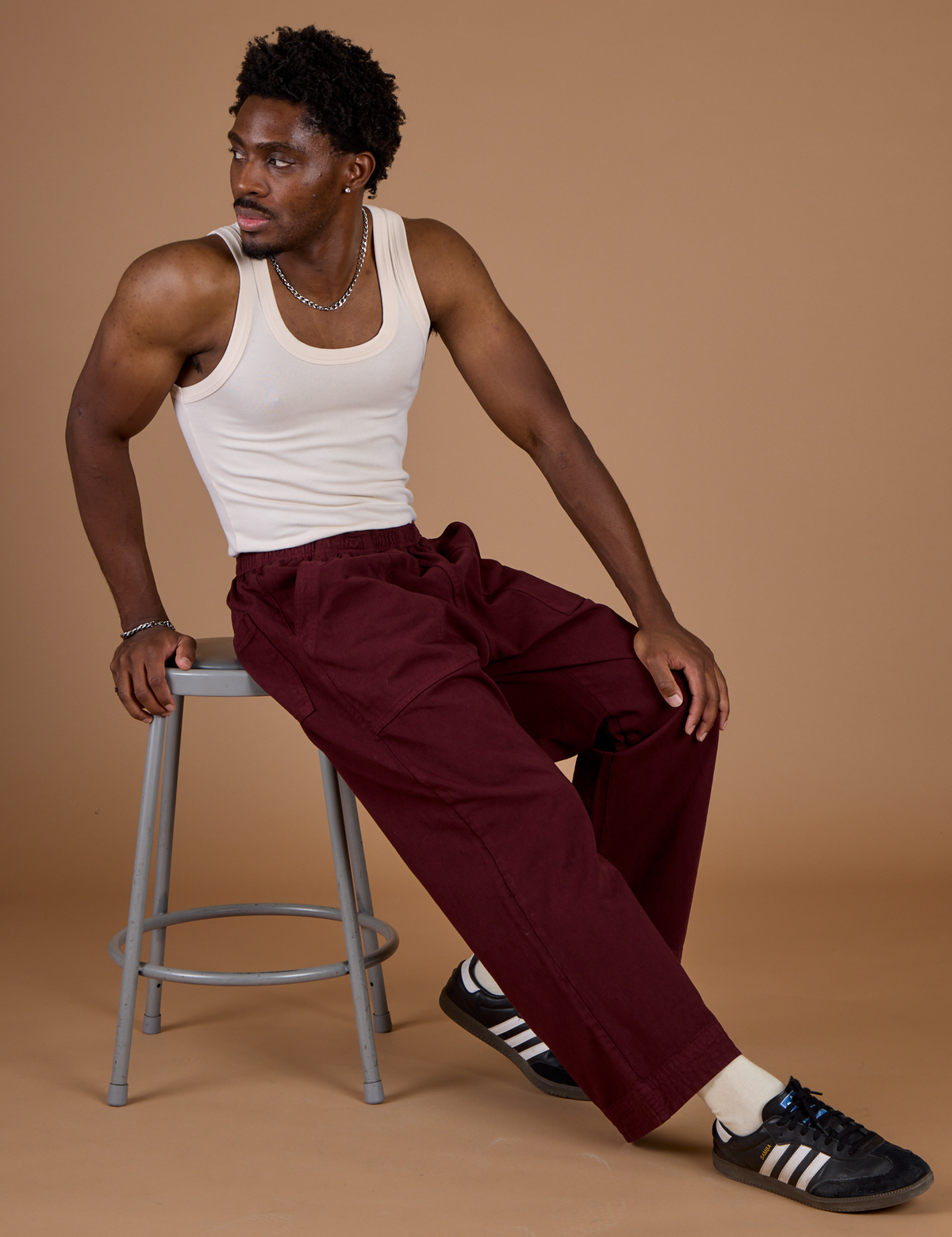 Isaac wearing the Red Wine Action Pant with the Vintage Tee off-White Tank Top