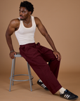 Isaac wearing the Red Wine Action Pant with the Vintage Tee off-White Tank Top