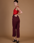 Angled back view of the Red Wine Action Pant