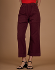 Close up of the Red Wine Action Pant on Alex