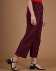 Side view of the Red Wine Action Pant on Alex