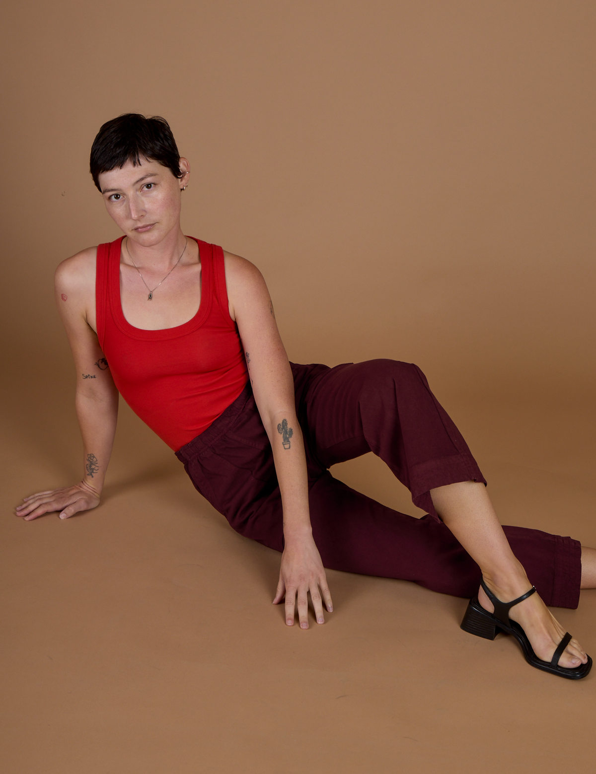 Alex wearing the Red Wine Action Pant with Mustang Tank Top