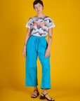 Alex wearing the Dark Cloud & Sky Airbrush Vintage Tee tucked into the Hawaiian Blue Drop Pocket Cargo Pants