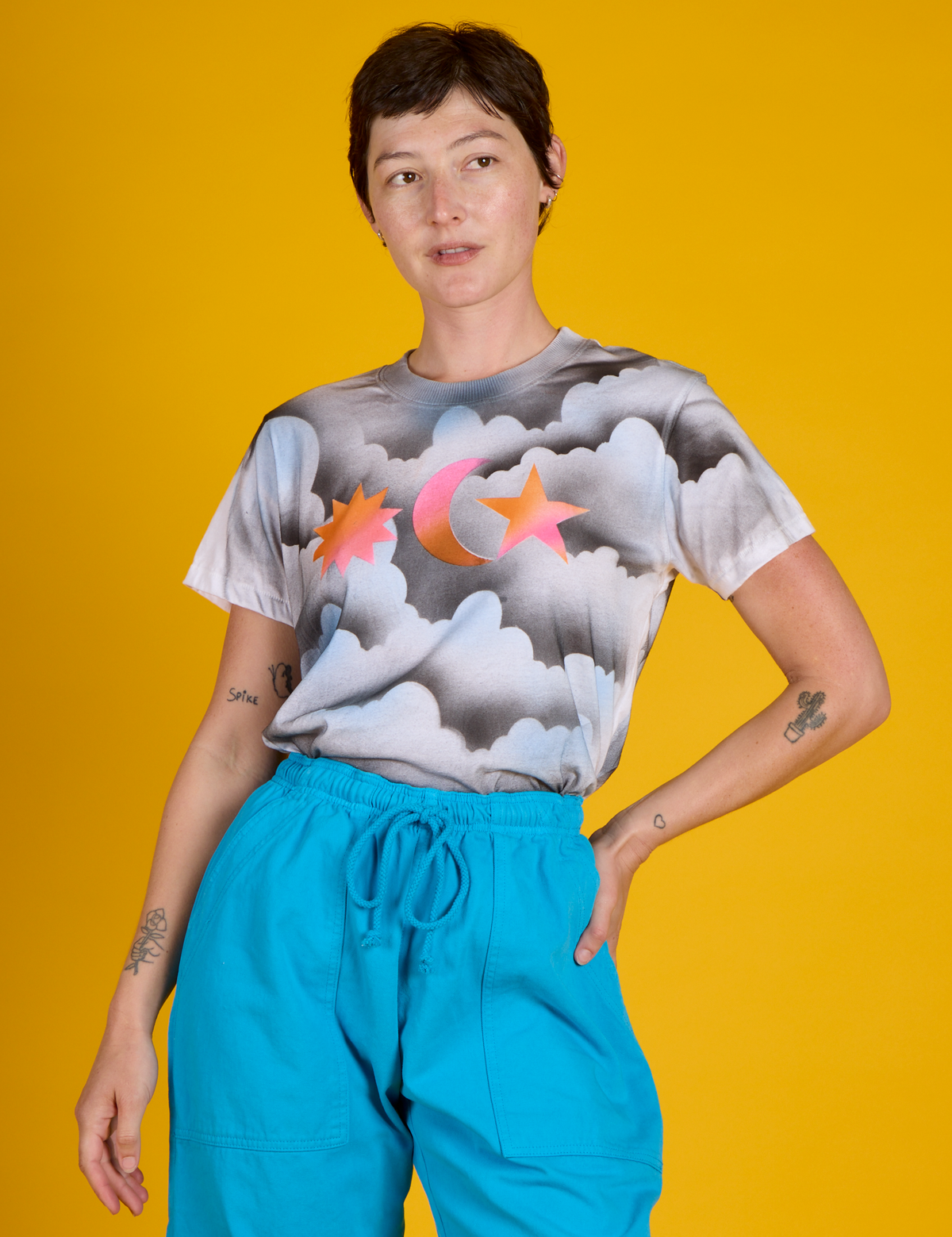 Alex wearing the Dark Cloud &amp; Sky Airbrush Vintage Tee tucked in
