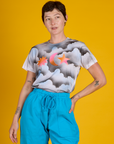 Alex wearing the Dark Cloud & Sky Airbrush Vintage Tee tucked in