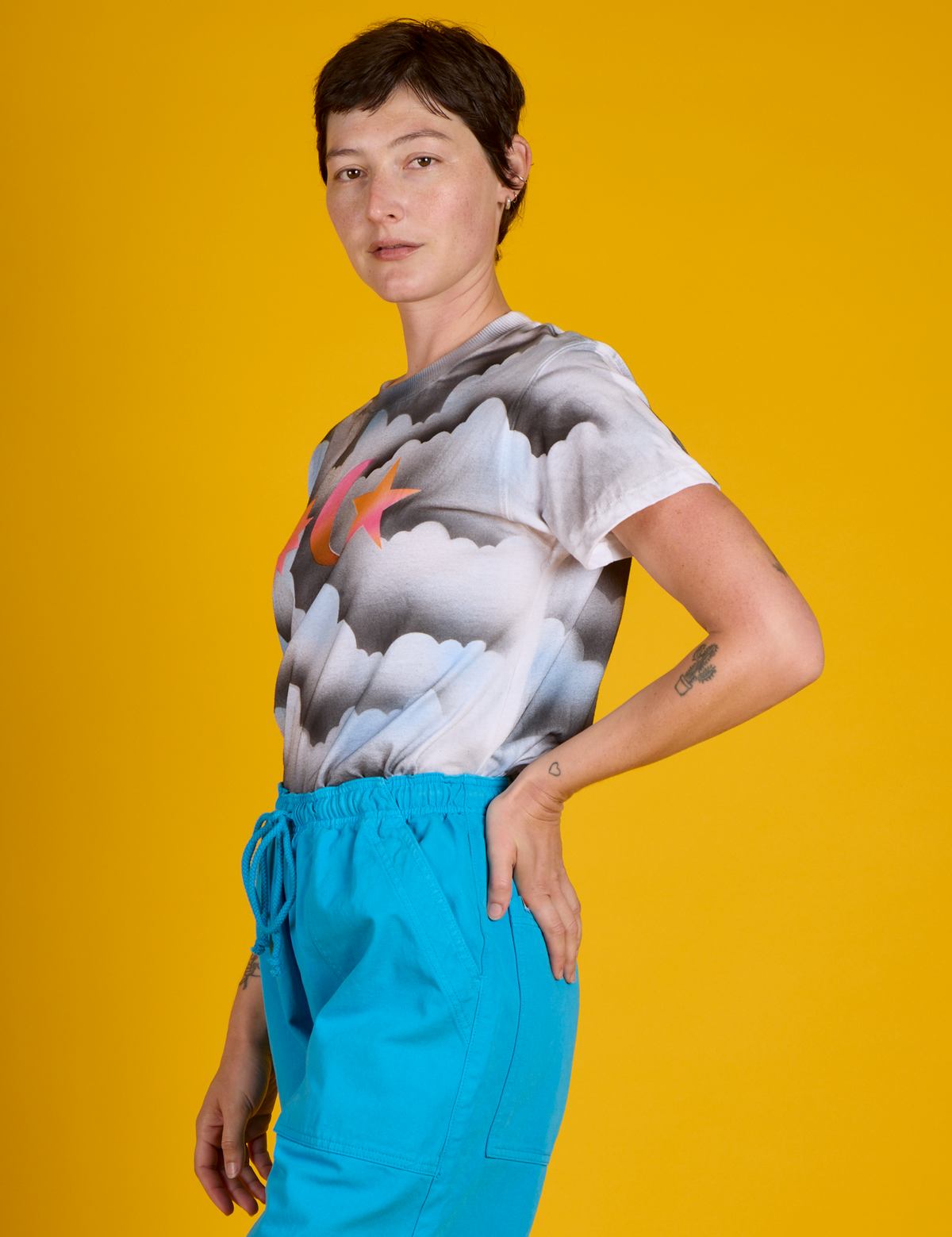 Side view of Alex in the Dark Cloud &amp; Sky Airbrush Vintage Tee