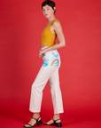 Side view of Alex wearing the Pockets of Sky Airbrush Work Pants
