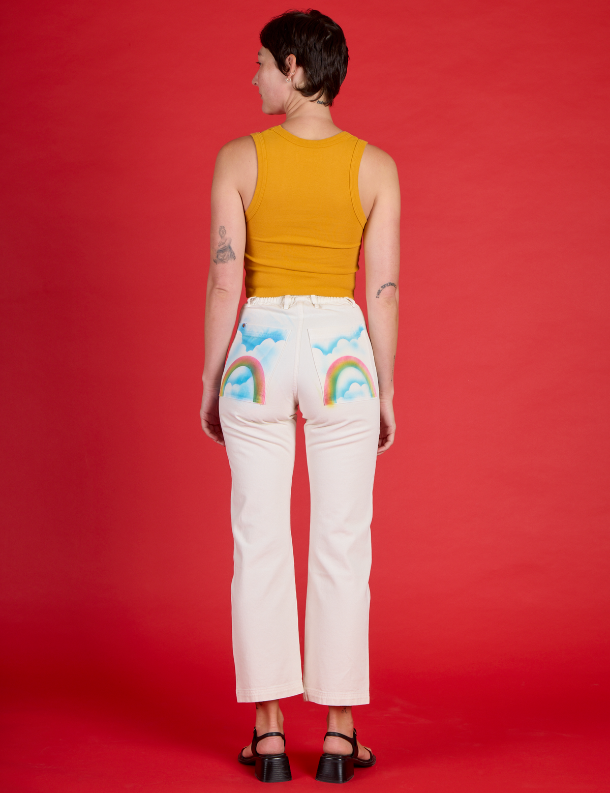 Back view of Alex in the Pockets of Sky Airbrush Work Pants