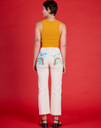 Back view of Alex in the Pockets of Sky Airbrush Work Pants