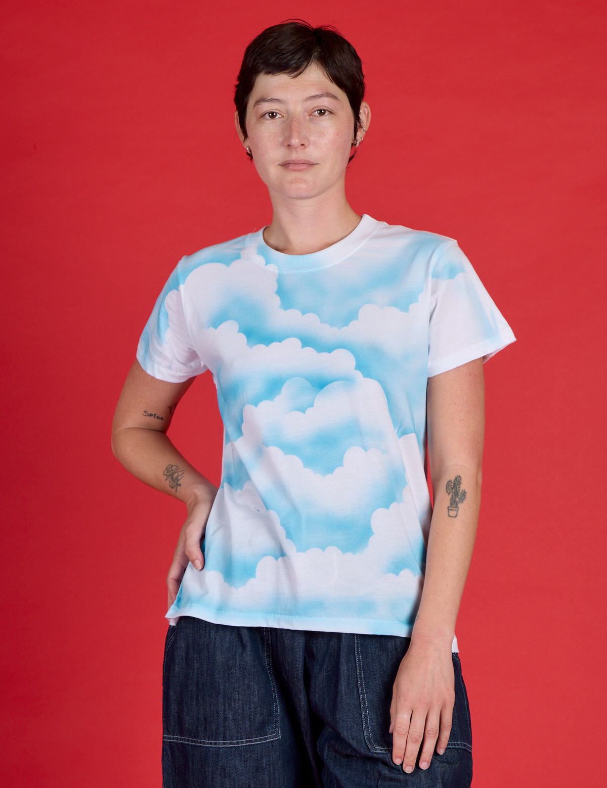 Alex is wearing the Cloud Coverage Airbrush Vintage Tee