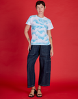 Alex is wearing the Cloud Coverage Airbrush Vintage Tee with Dark Wash Denim Drop Pocket Pants