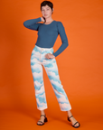 Alex wearing the Cloud Coverage Airbrush Work Pants with French Blue Long Sleeve Baby Tee