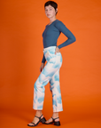 Side view of Alex in the Cloud Coverage Airbrush Work Pants
