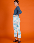 Angled back view of the Cloud Coverage Airbrush Work Pants on Alex