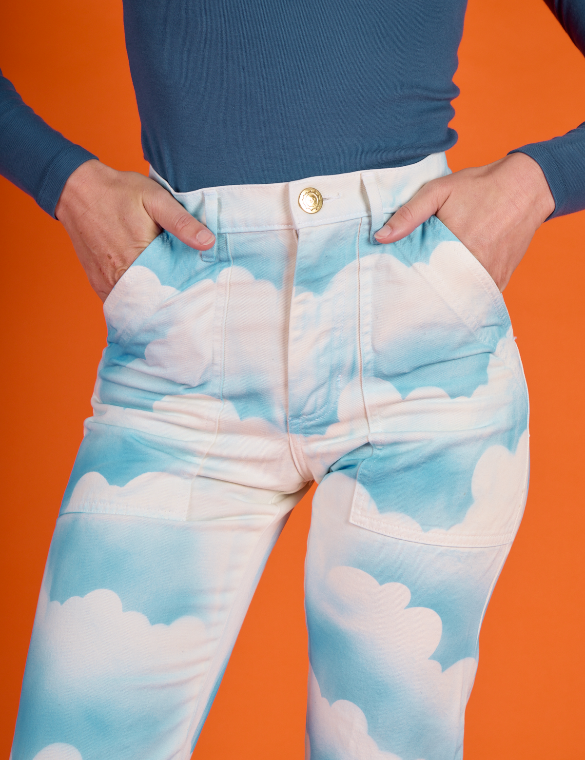 Close up of Alex's hand in the front pockets of the Cloud Coverage Airbrush Work Pants