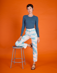 Alex wearing the Cloud Coverage Airbrush Work Pants with French Blue Long Sleeve Baby Tee