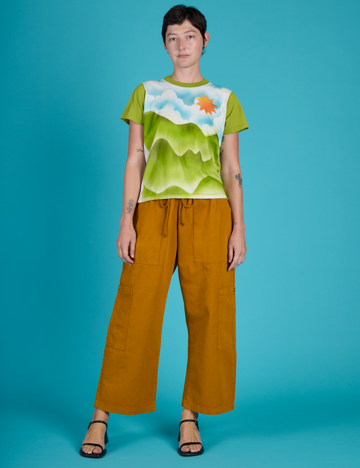 Alex wearing the Green Hills Airbrush Vintage Tee with Spicy Mustard Drop Pocket Pants