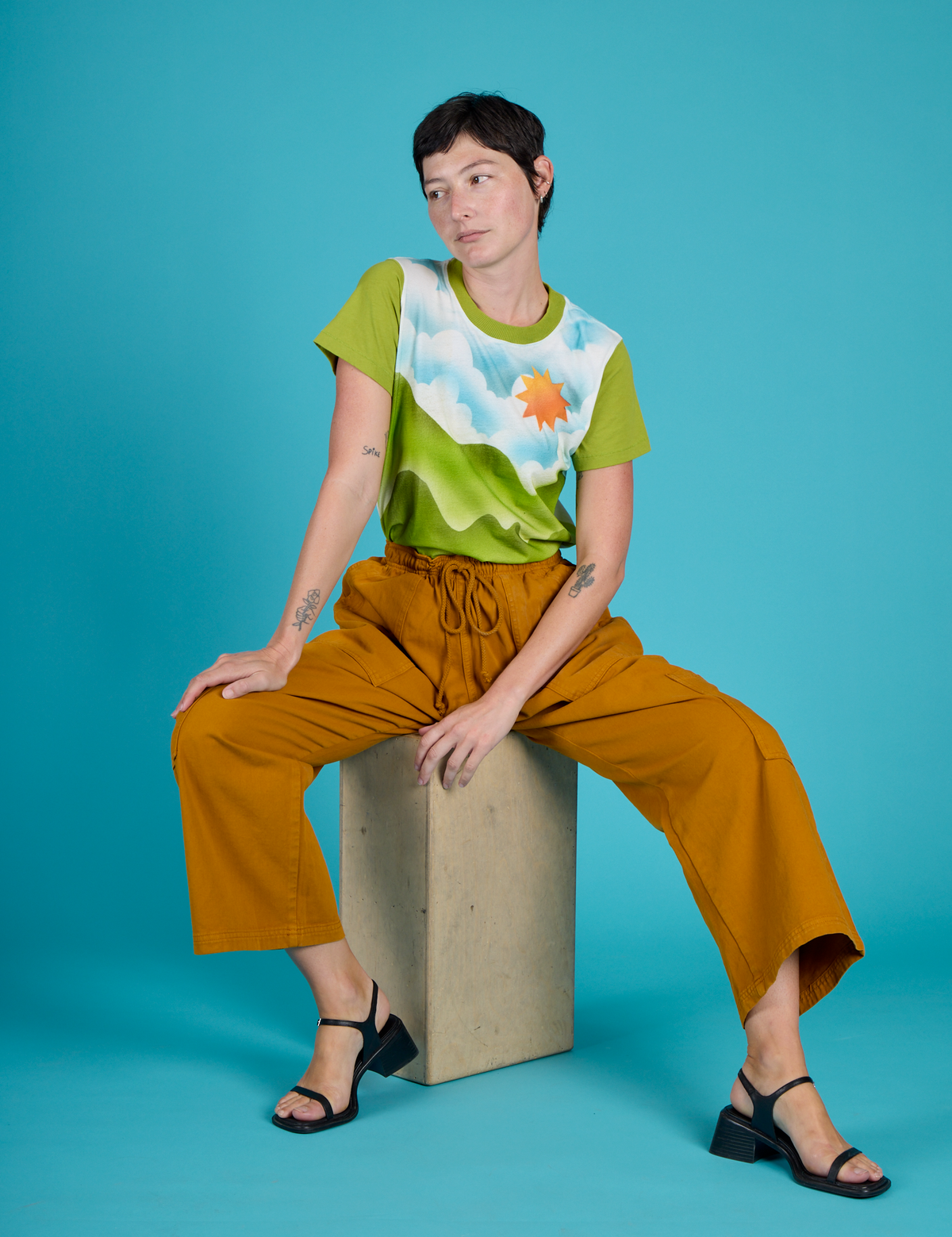 Alex wearing the Green Hills Airbrush Vintage Tee with Spicy Mustard Drop Pocket Pants
