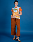 Alex is wearing the Orange Mesa Airbrush Vintage Tee with Burnt Terracaotta Drop Pocket Pants