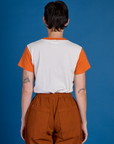 Back view of the Orange Mesa Vintage Airbrush Tee on Alex