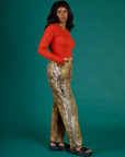 Angled side view of Kandia wearing the Leopard Work Pant