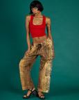 Kira is 5'10" and wearing XS Leopard Drop Pocket Pants with the Mustang Red Cropped Tank