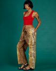 Angled side view of Kira wearing the Leopard Drop Pocket Pant