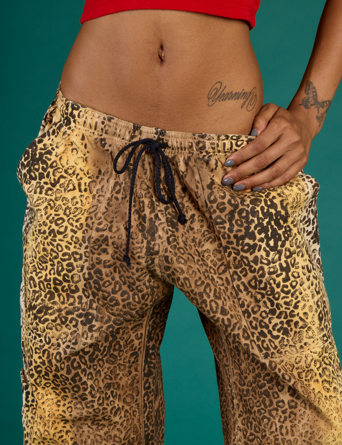 Close up on the waistband of the Leopard Drop Pocket Pant on Kira