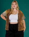 Juliet is wearing the Leopard Pantry Button Up open with the Vintage Tee White Cropped Tank underneath