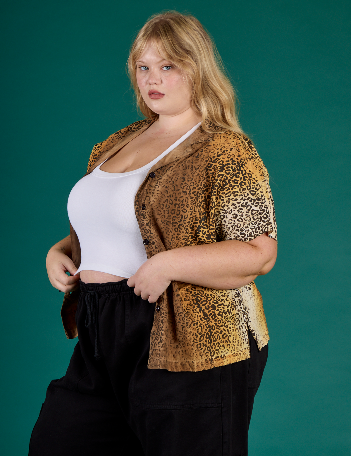 Angled side view of the Leopard Pantry Button Up on Juliet