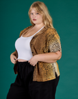 Angled side view of the Leopard Pantry Button Up on Juliet