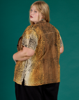 Angled back view of the Leopard Pantry Button Up on Juliet