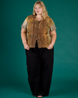 Juliet is wearing the Leopard Pantry Button Up with Black Drop Pocket Cargo Pants