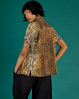 Angled back view of the Leopard Pantry Button Up on Kira
