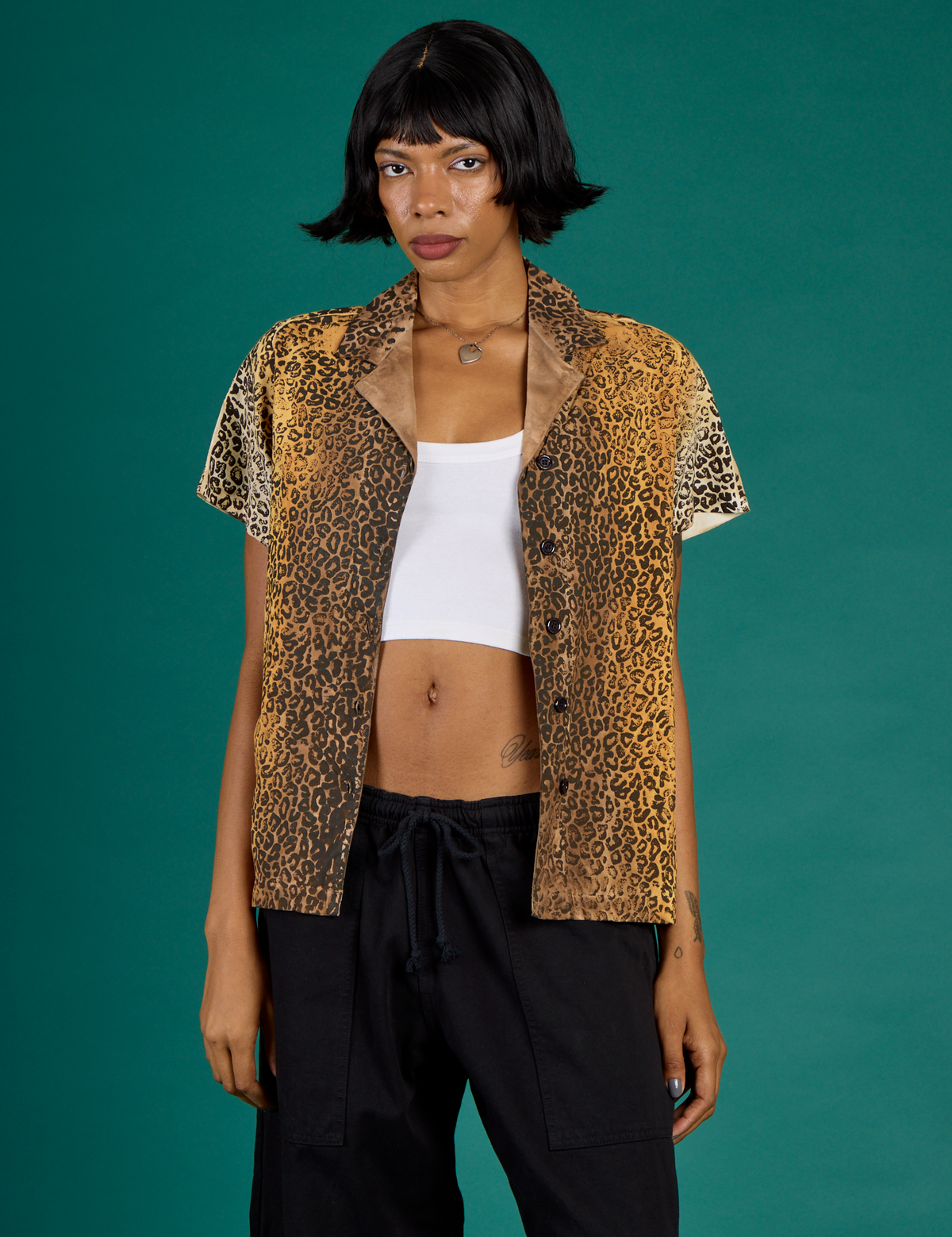 Kira is wearing the Leopard Pantry Button Up