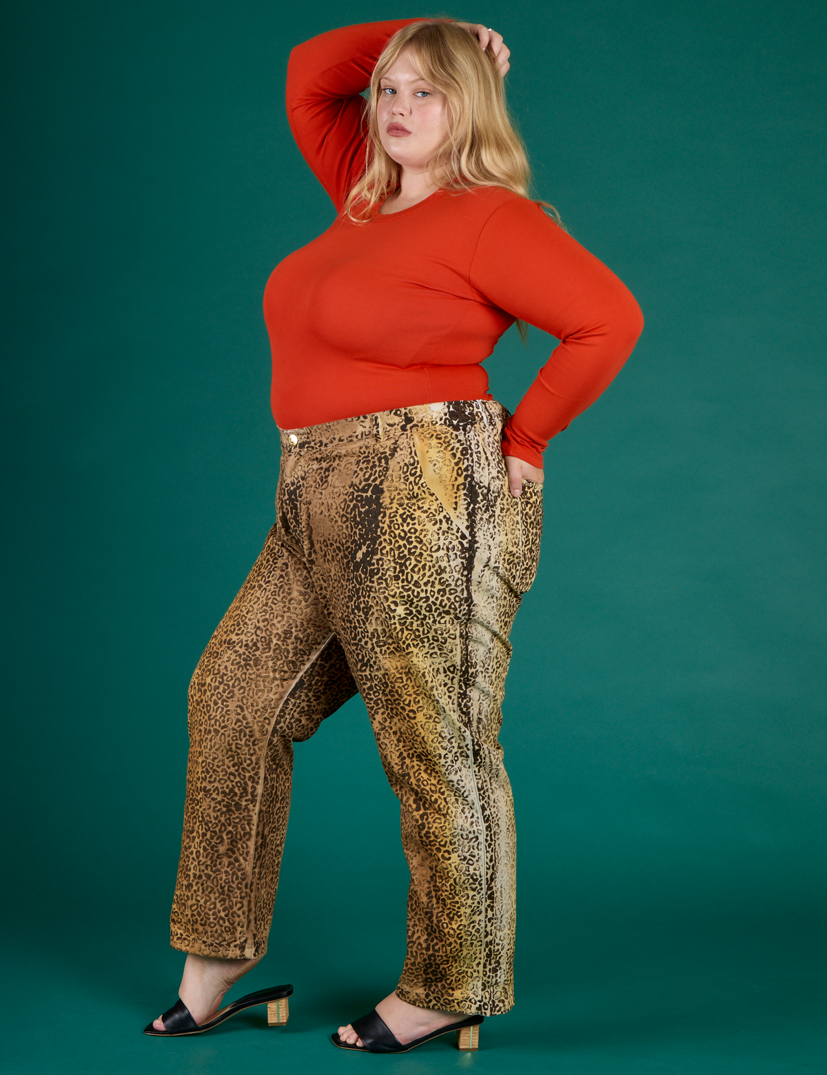 Angled side view of Juliet wearing the Leopard Work Pant