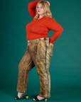 Angled side view of Juliet wearing the Leopard Work Pant