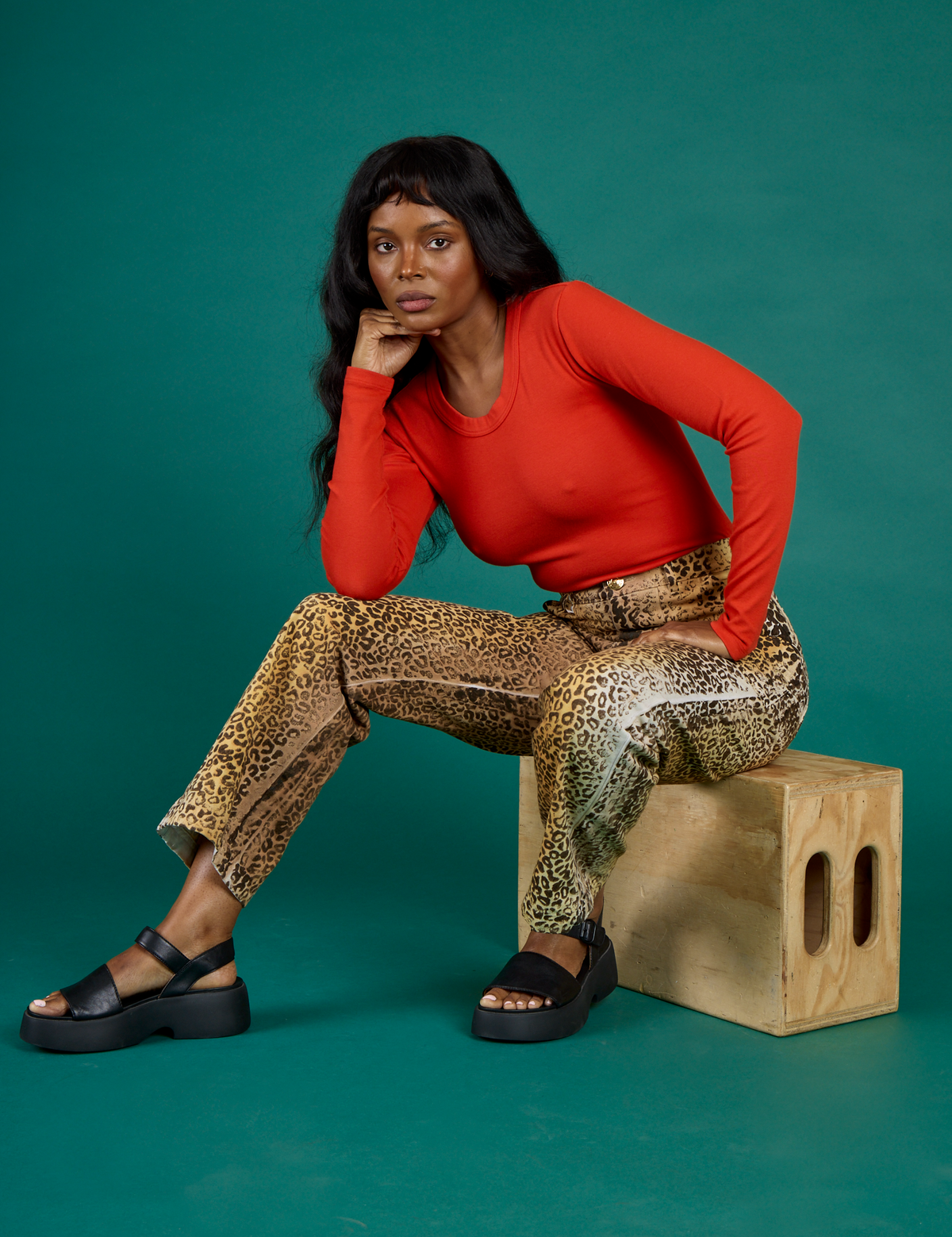 Kandia wearing the Leopard Work Pant with Chili Red Long Sleeve Baby Tee