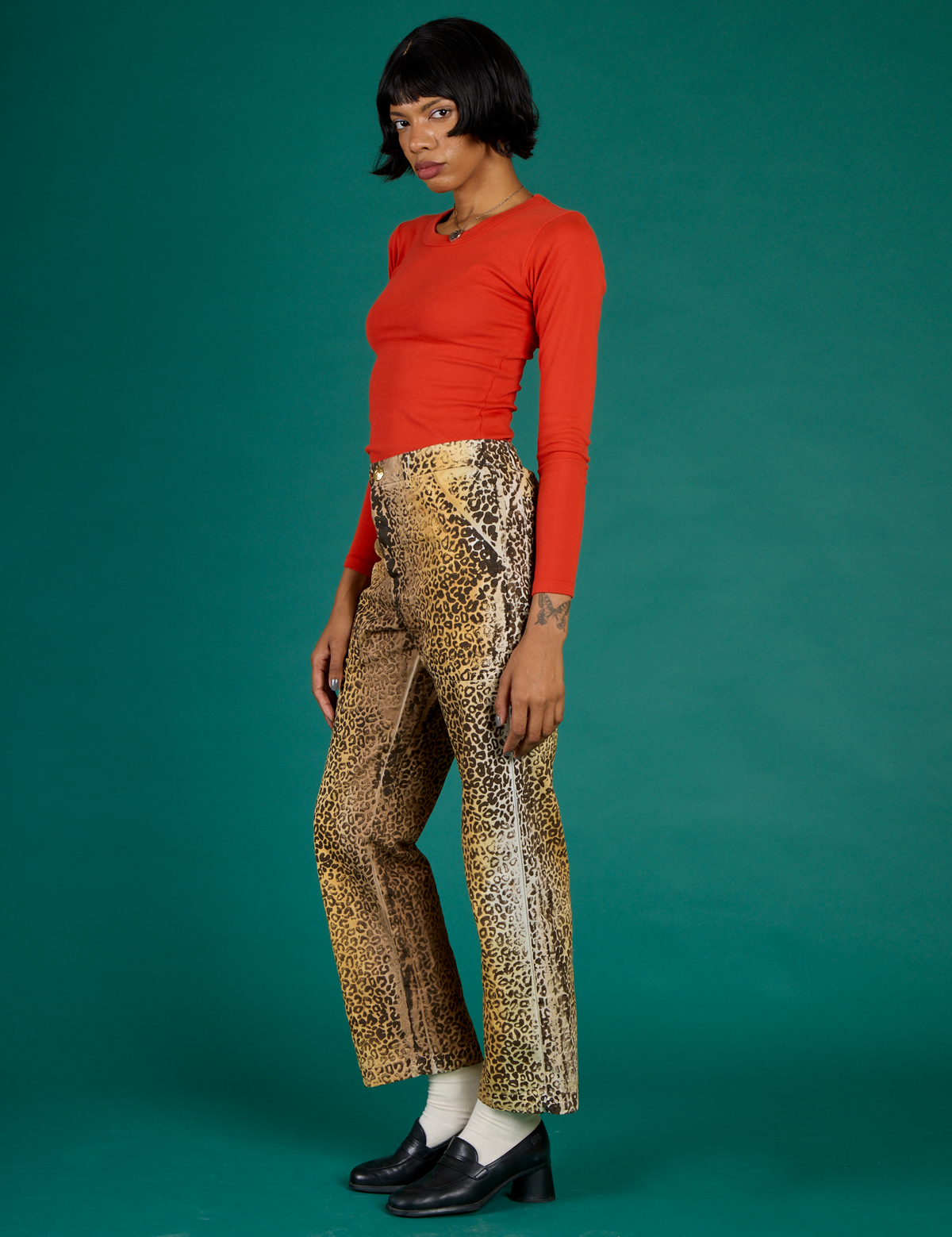 Kira wearing the Leopard Work Pant with the Chili Red Long Sleeve Baby Tee