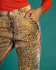 Close up of Kira's hand in the front pocket the Leopard Work Pant