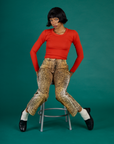 Kira wearing the Leopard Work Pant with the Chili Red Long Sleeve Baby Tee